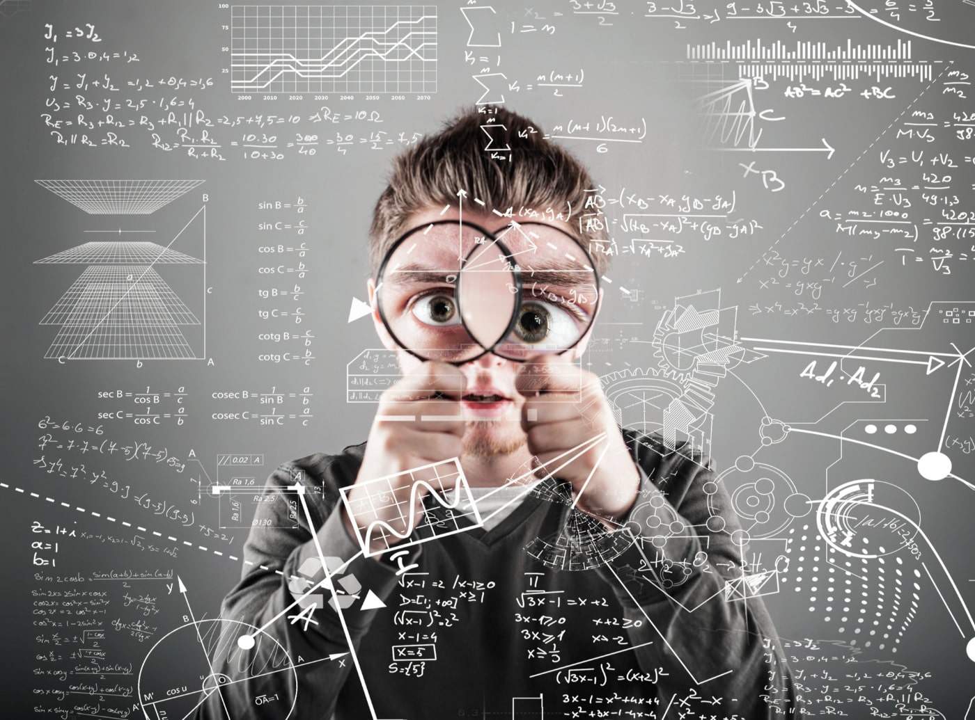 man with magnifying glasses solving actuarial mathematics