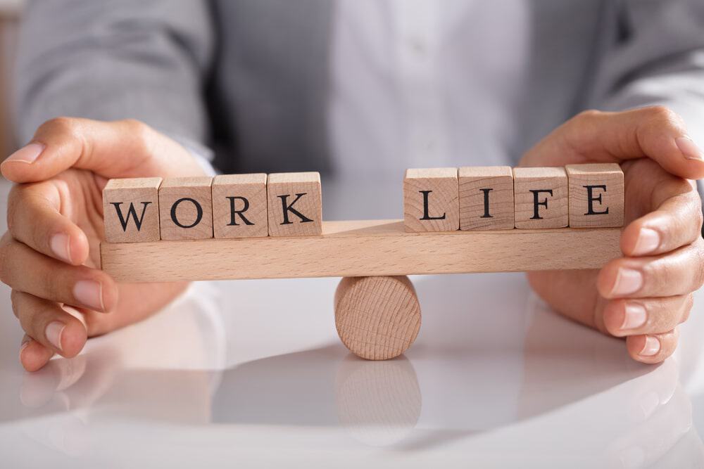 Actuary balancing work and life responsibilities, illustrating the definition of actuary and the profession's work-life balance.