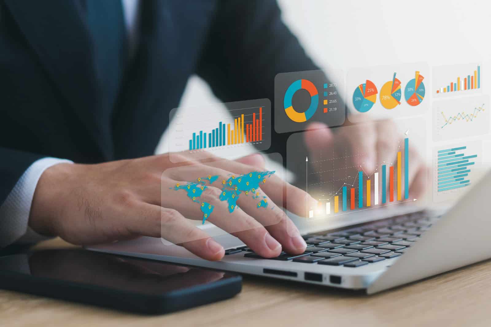 concept of actuary job description - working on his laptop